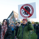 In this Oct. 24, 2019, file photo, Native American leaders protest against the Redskins team name outside U.S. Bank Stadium before an NFL football game between the Minnesota Vikings and the Washington Redskins in Minneapolis.